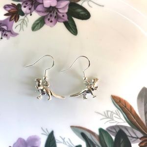 Small T-rex silver tone earrings